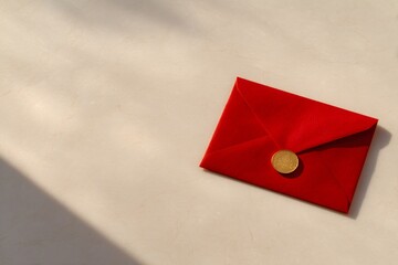 eid celebration card, eid composition features red envelope, small gold coin on a creamy background with shadows, and ample space for text