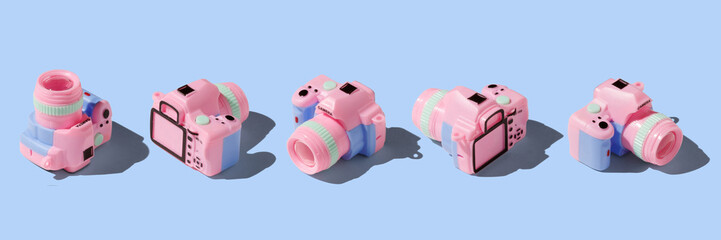 Colorful toy camera on pastel color background