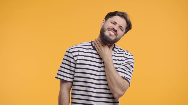 Mature Bearded Man Has Sore. Sick Guy With Swollen Throat On Yellow Studio. Pain