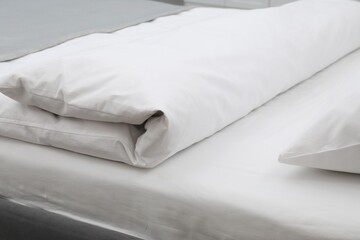 Fototapeta premium Comfortable bed with clean linens in bedroom, closeup