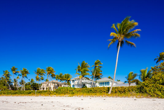 Beachfront homes on Naples Beach Florida. Long exposure art photo