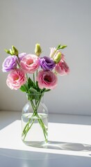 Fototapeta premium Lisianthus flowers in a clear glass vase bathed in soft natural light, featuring elegant pastel pink and purple blooms, flower, pink, freshness