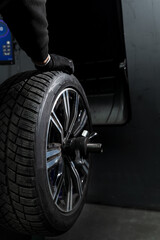 Seasonal tire replacement in a professional tire service workshop. © Rabizo Anatolii