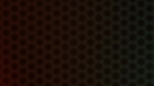 Dark abstract honeycomb pattern background with subtle color gradient illumination&nbsp;creating a seamless loop