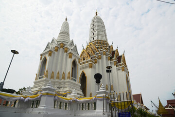 Main large white Pagoda at Wat Phichaya Yatikaram features a blend of Thai and Chinese architectural styles. Located at Bangkok capital city in Thailand.