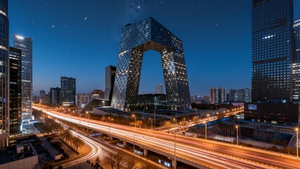 Obraz premium Nighttime cityscape with illuminated highway