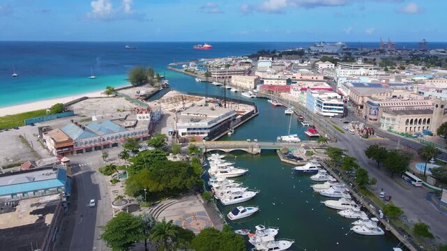 Yachts moored at Careenage (Constitution River) in historic city center of Bridgetown, Barbados. Historic Bridgetown and its Garrison is a UNESCO World Heritage Site.
