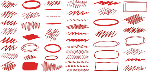 Collection of red abstract shapes and scribbles on a plain surface viewed from directly above