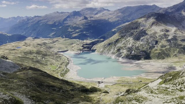 Drone panoramic view of Monte Spluga Lake - Turquoise water in Alps