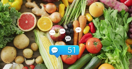 Showing bright flat-lay produce on wood board, with corn, halved citrus and blue 51 bubble © vectorfusionart