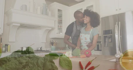 Fotobehang Koken Preparing couple wearing aprons hugging while chopping broccoli on cutting board at kitchen island  © vectorfusionart