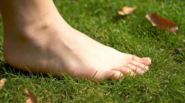 close-up of bare human foot touching natural ground outdoors