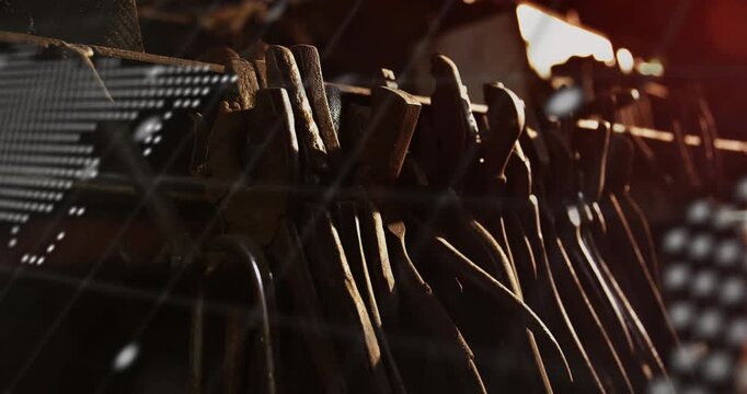 Hanging tools emerging as dot map scrolling and terminal text pulsing, highlighting metal texture