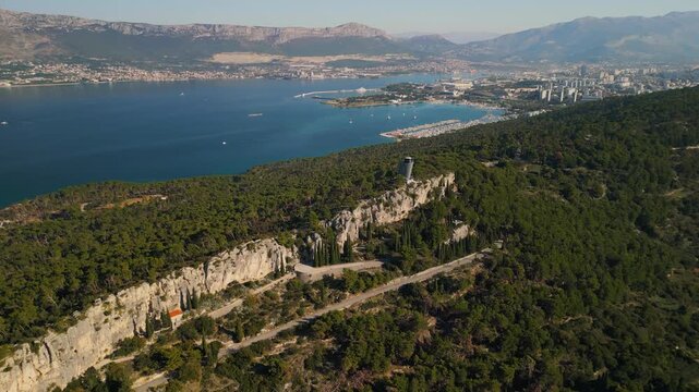 Aerial 4K view of Marjan Forest Park rocky cliffs and Split city skyline in Dalmatia, Croatia