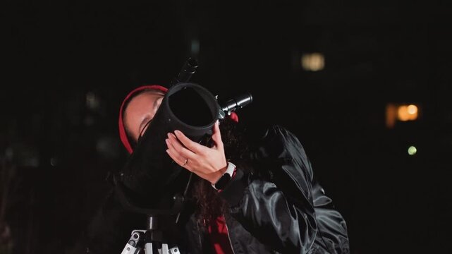white hands adjusting telescope on rooftop, red hood and glasses bearded operator calibrating mount and focus, urban night skyline backdrop, fine tuning exposure and tracking, excited discovery mood,