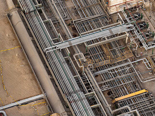 Fototapeta premium View of a spool of stainless steel and carbon steel pipes installed in an oil and gas refinery