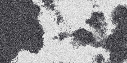 Textured abstract background in grayscale with irregular dark patches and a speckled granular surface creating a naturalistic organic pattern