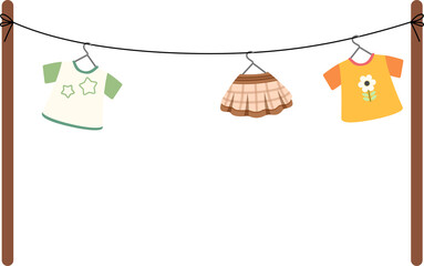 Clothing items hanging on a clothesline with shirts and skirts in a domestic environment viewed from the front