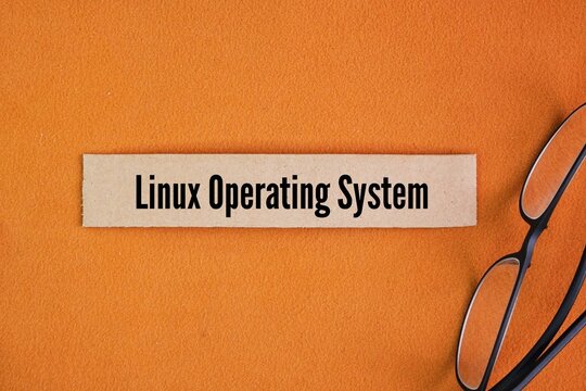 Glasses and paper box with the words linux operating system. open-source, Unix-like operating system based on the Linux kernel