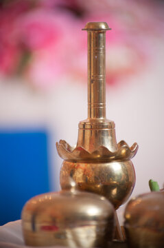 Traditional Malay Brass Wedding Tepak Sireh Set. A detailed macro shot of a polished brass ceremonial container used in traditional Malaysian cultural events and weddings.