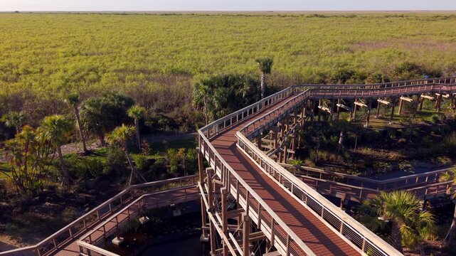 Wood boardwalk Florida Everglades I95 rest area. Aerial 4k drone footage 2026