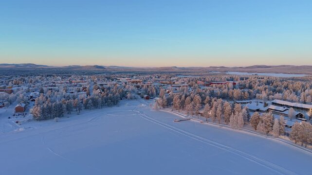 Arvidsjaur Town Aerial Pullback - Sunny Snow Covered Lapland Village