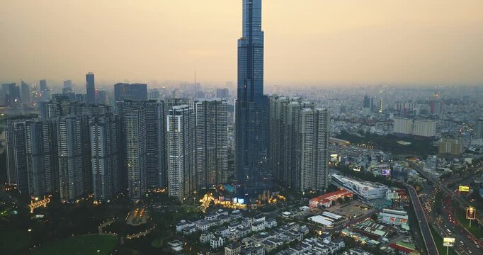 Aerial view of Ho Chi Minh City skyline and skyscrapers in center of heart business at Ho Chi Minh City downtown. Financial and business centers in developed Vietnam. Sunset to night.
