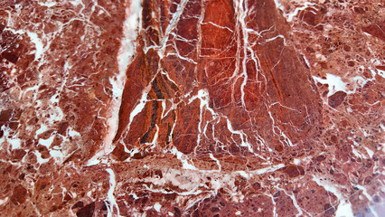 Fototapeta premium Close up of red marble with white patterns found in nature