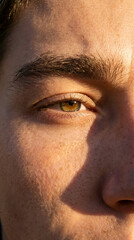 Obraz premium close-up left eye, eyebrow, skin, nose details captured in photographic portrait from side view