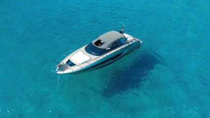 Aerial view of a luxury yacht anchored in crystal clear turquoise water, Sardinia © Alexandre ROSA