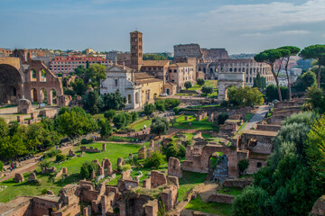 Obraz premium Ancient Roman Forum Ruins with Colosseum in Rome