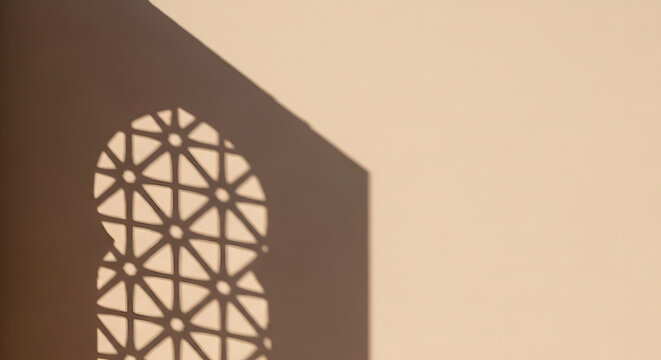 Geometric shadow of an Islamic arch pattern projected onto a bei