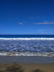 Calm Waves Under the Bright Sky