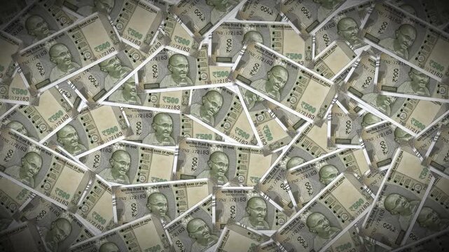 A large, unorganized pile of 500 Indian Rupee notes filling the frame. This "sea of cash" visual represents high liquidity, abundant wealth, or large-scale financial transactions in the Indian market.