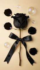 Elegant Black Rose with Ribbon Surrounded by Bubbles and Petals on Soft Beige Background