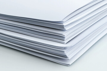 Fresh stack of blank paper sheets, ideal for printing or writing, showcasing clean edges and smooth texture, perfect