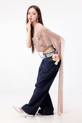 Modern trendy Thai fashion woman wearing a traditional Sabai paired with denim jeans, reflecting...
