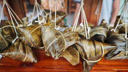 Zongzi, an ancient Chinese traditional dish wrapped in fragrant leaves, crafted with fine ingredients and cherished in cultural festival rituals.