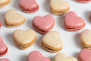 Fototapeta premium Heart Shaped Macarons Arranged on a White Background for a Sweet Treat Display