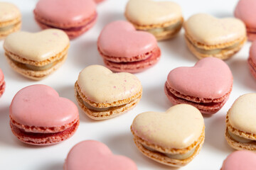 Obraz premium Heart Shaped Macarons Arranged on a White Surface for a Dessert Display During a Special Event
