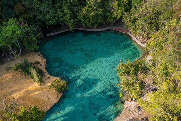 Fototapeta premium Emerald Pool is a natural spring with a greenish-blue color, located in a protected forest and wetland area within the Khao Pra-Bang Kram Wildlife Sanctuary in Krabi Province, Thailand.