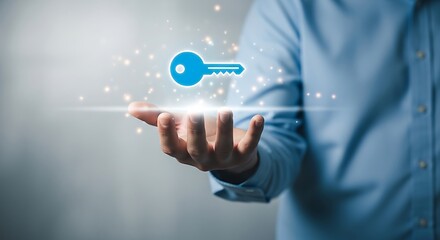 Fototapeta premium A person holding a glowing blue key in their hand