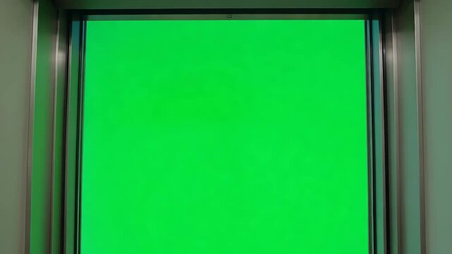 Modern Elevator Doors Opening with Vibrant Green Screen