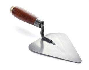 Close-up of a new trowel with a wooden handle on a white background