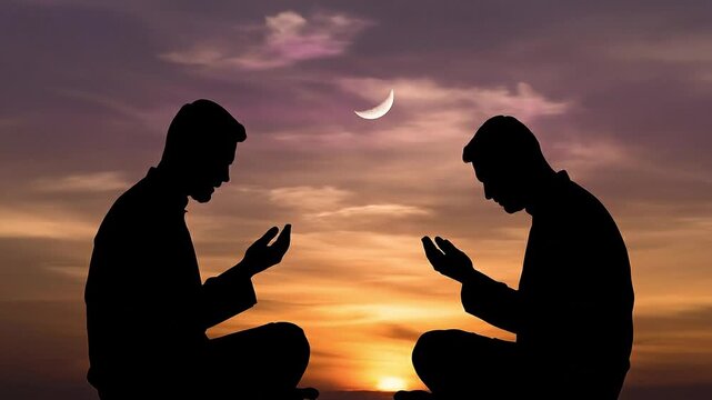 A static shot captures two men in silhouette as they pray at sunset.