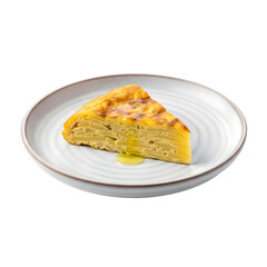 A slice of quiche on a white plate with a drizzle of olive oil.