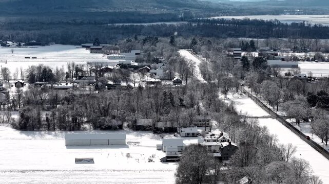 Route 9 Hadley Massachusetts and farm fields in winter, frozen aerial establishing