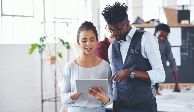 Review, meeting or people in office with tablet, guidance or market research for brand image. Collaboration, partner or creative director in agency with tech, plan or feedback for business identity.