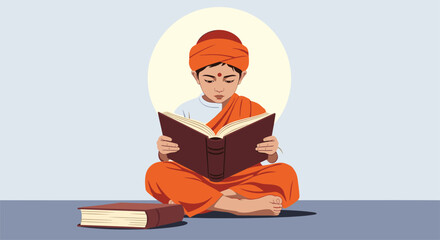 Young monk wearing orange robes and a turban sitting cross-legged while reading a large book with a book pile nearby.