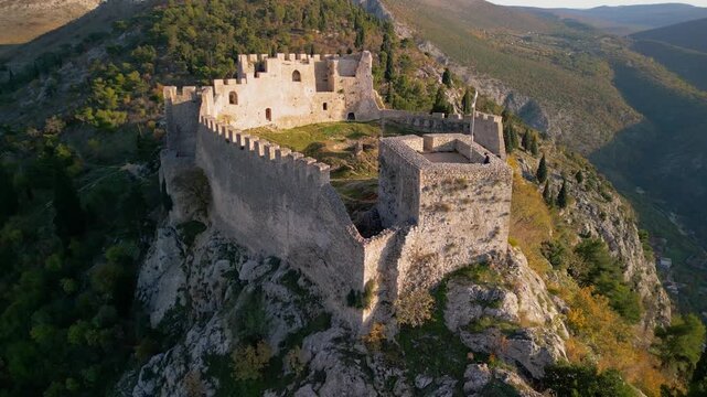 Stjepan Grad Castle Fortress in Blagaj, Bosnia - 4K aerial drone view during Golden Hour